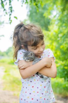 Little kittens in the hands of children. Selective focus.