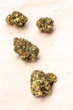 Detail of legal marijuana flowers photographed on paper  background