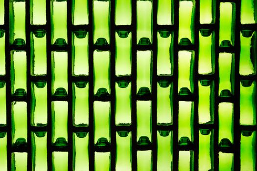 Green glass tiles create an artistic pattern.