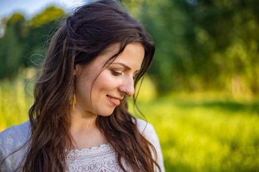 nice portrait of beautiful and young groom and bride outdoors