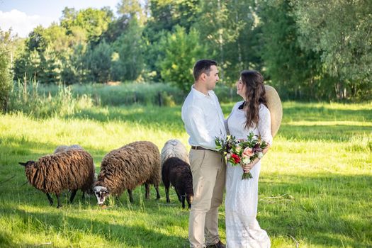 nice portrait of beautiful and young groom and bride outdoors