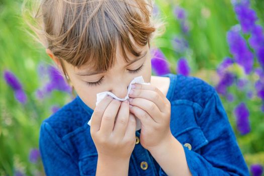 Seasonal allergy in a child. Coryza. Selective focus.