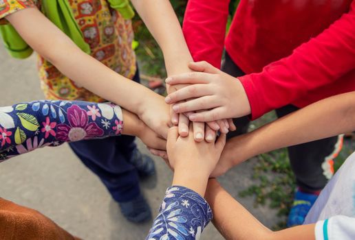 hands of children, many friends, games. Selective focus summer