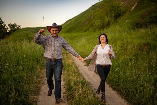 nice portrait of beautiful and young groom and bride outdoors