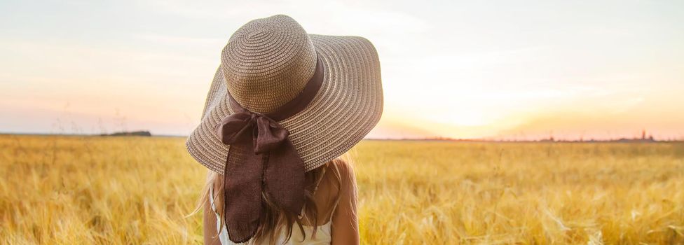 A child in a wheat field. Sunset. Selective focus. nature.