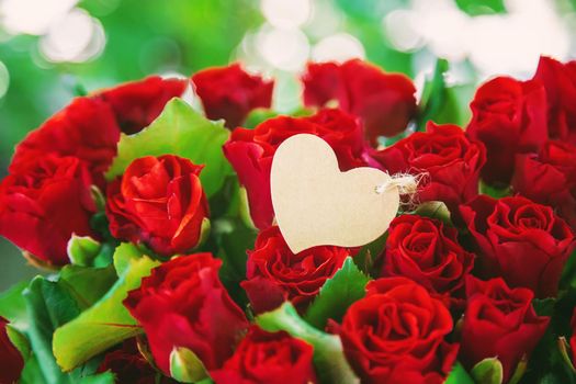 Bouquet of red roses, a gift for Valentine's Day. Selective focus. Holiday.