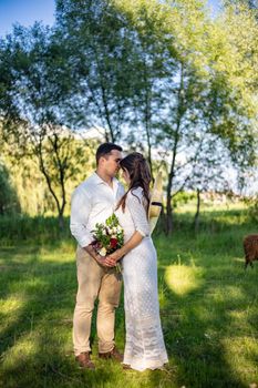 Elegant bride and groom posing together outdoors on a wedding day