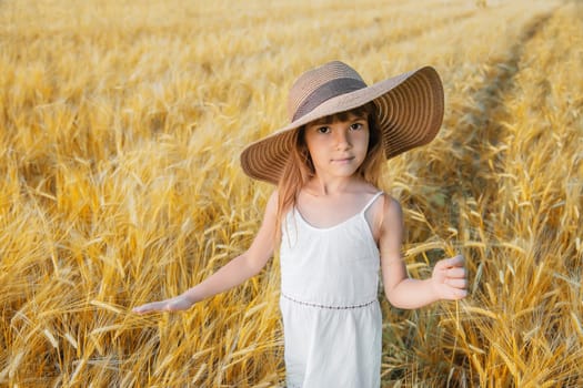 A child in a wheat field. Selective focus.
