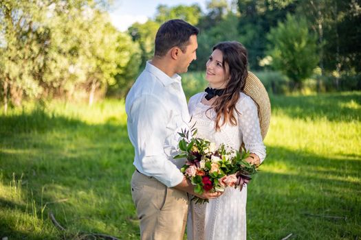 nice portrait of beautiful and young groom and bride outdoors