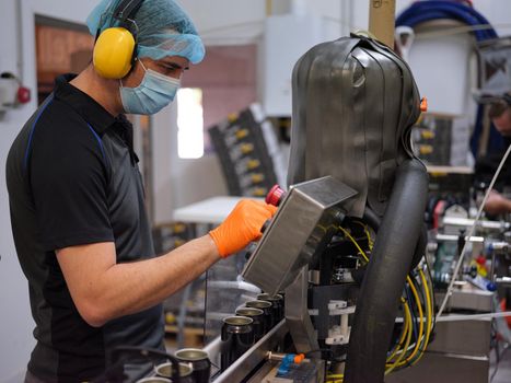 Profile of a worker using an electronic beer packaging machine in a brewery