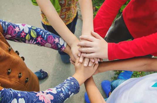 hands of children, many friends, games. Selective focus summer
