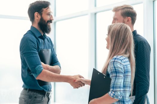 handshake business people in the office lobby . concept of cooperation