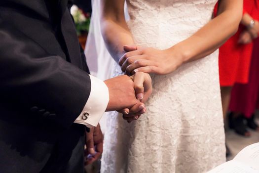 holding hands during the wedding ceremony