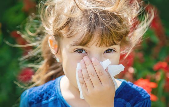 Seasonal allergy in a child. Coryza. Selective focus.