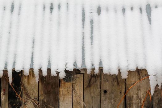 The icy roof with walls in wood