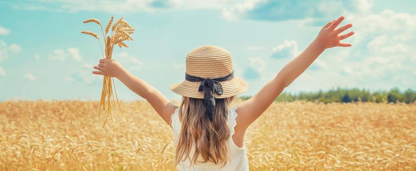 A child in a wheat field. Selective focus. nature.