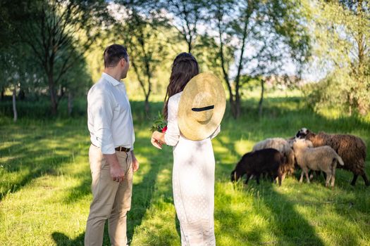 nice portrait of beautiful and young groom and bride outdoors