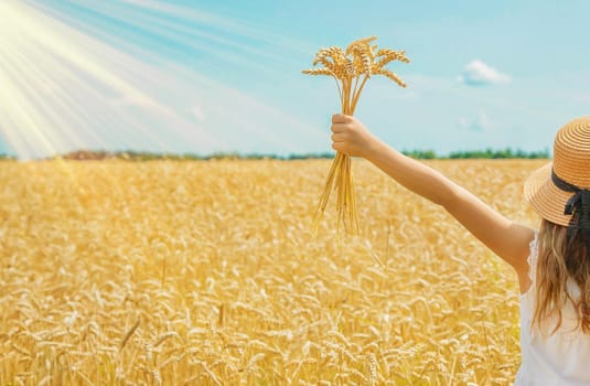 A child in a wheat field. Selective focus. nature.