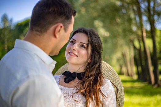 nice portrait of beautiful and young groom and bride outdoors