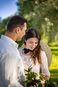 nice portrait of beautiful and young groom and bride outdoors