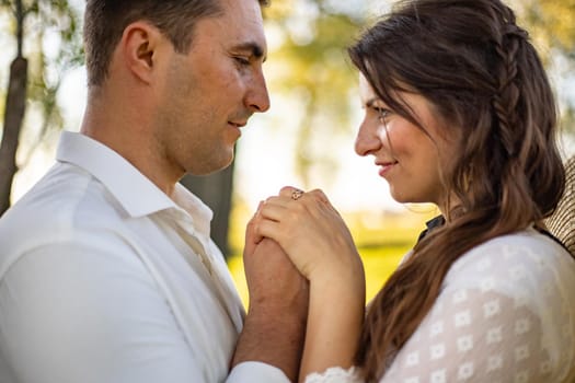 nice portrait of beautiful and young groom and bride outdoors