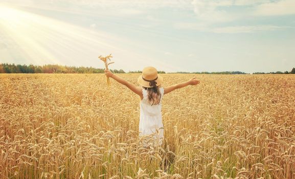 A child in a wheat field. Selective focus. nature.