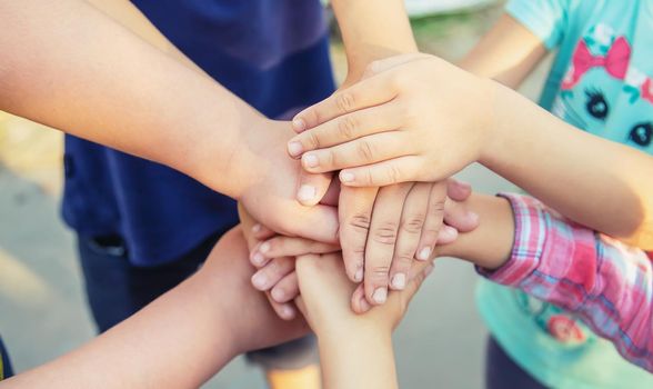 hands of children, many friends, games. Selective focus summer