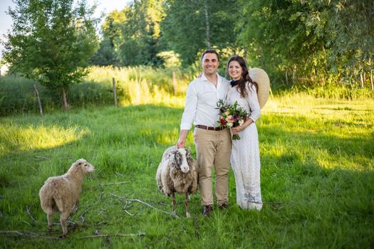 nice portrait of beautiful and young groom and bride outdoors