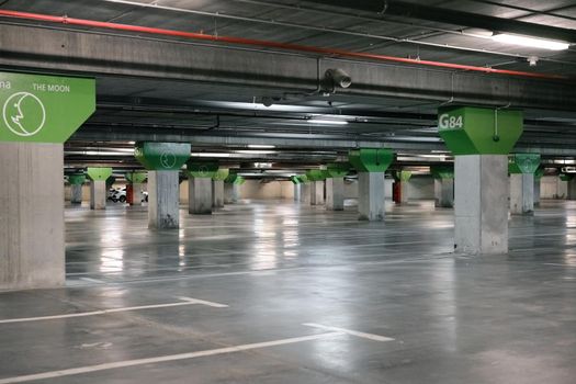 Empty parking car with the space marked on the ground in white lines