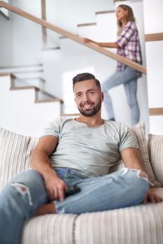 close up. young man sitting on sofa. photo with copy space