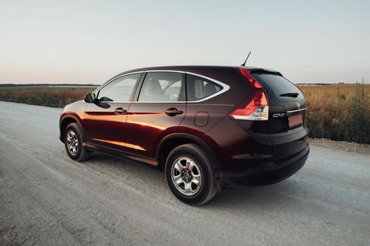 TERNOPIL, Ukraine - July 21 2021: Back View of Honda CR-V on Country Road