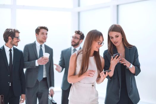 young employees exchanging information in the office lobby. office weekdays