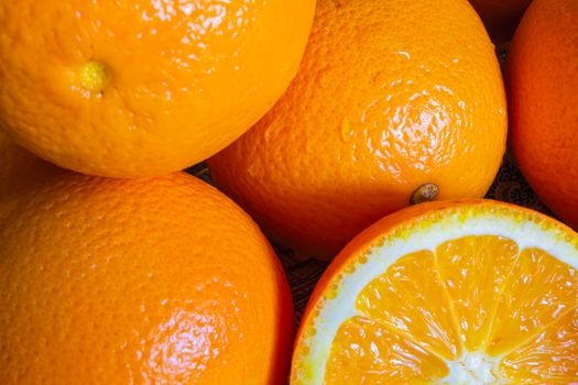 Tasty, ripe and juicy oranges close-up in the summer for a juicer