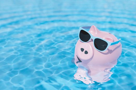 High angle 3d rendering of trendy sunglasses on pink piggy bank floating in rippling water of swimming pool in sunlight