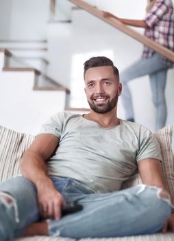 close up. young man sitting on sofa. photo with copy space