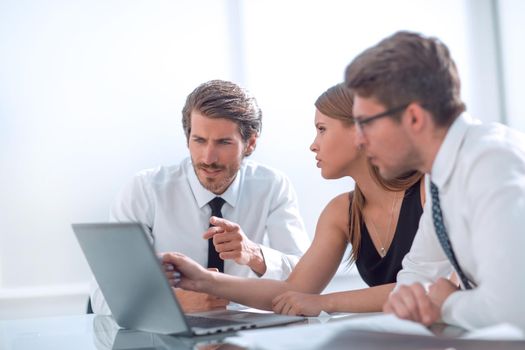 young employees hold a video meeting in the office. people and technology