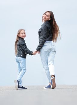 rear view. mother and daughter step forward. photo with copy space