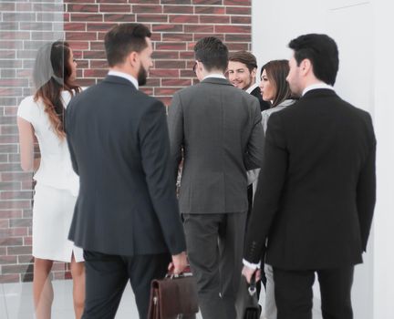 group of business people talking, standing in the lobby of the business center.photo with copy space