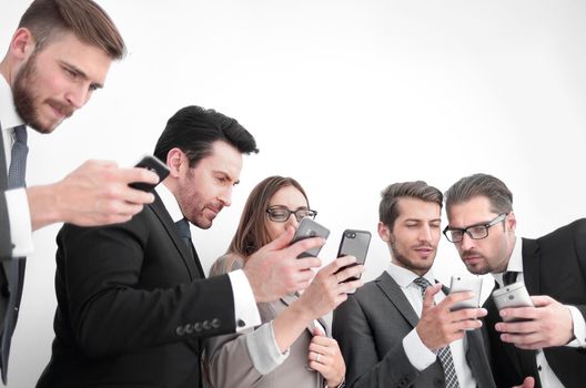 Group of young Businessman and Businesswoman looking at their smartphones and discussing for their project. Business and internet concept.