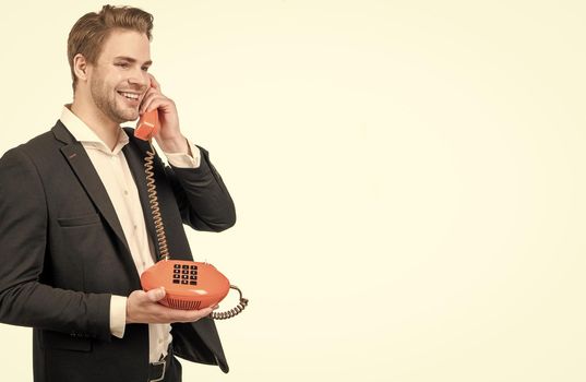 Happy professional man talk on old-fashioned vintage telephone call isolated on white, retro connection.