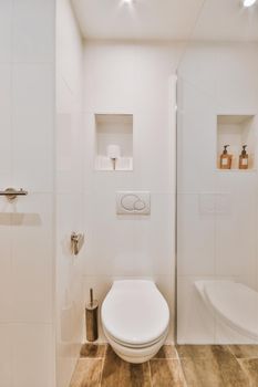 Interior of small clean restroom in miniature style