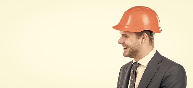 Engineering that works. Civil engineer side-face. Happy engineer in hardhat. Profile portrait of construction man. Constructor isolated on white. Reliable professional, copy space.