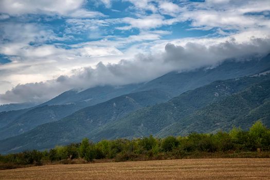 Beauty landscape of fog and clouds rolling over the forested mountain