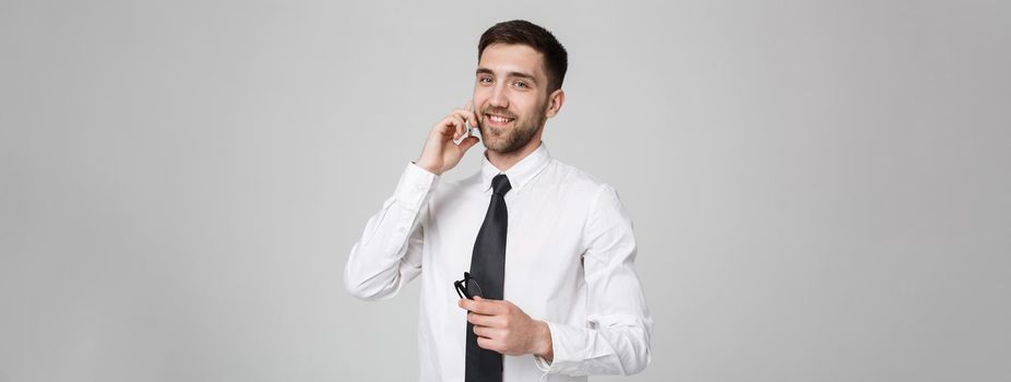 Lifestyle and Business Concept - Portrait of a handsome businessman enjoy talking with mobile phone. Isolated White background. Copy Space.