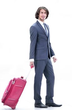 young businessman with travel suitcase .isolated
