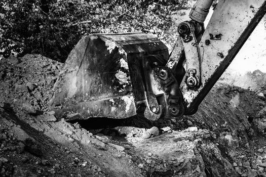 Industrial background. Digger bucket close-up. Construction excavator bucket.