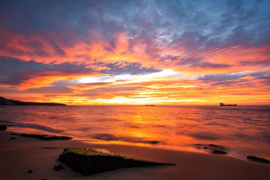 Amazing red sunrise over the sea.