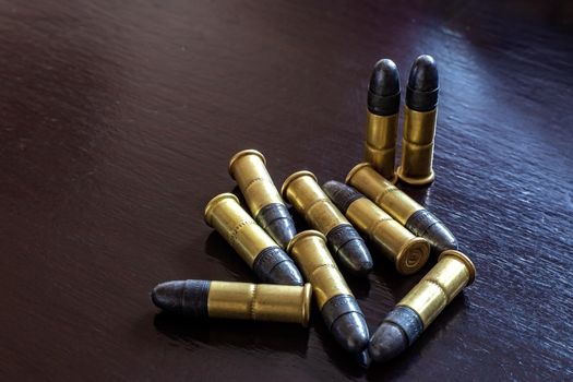 Bullets on the table. Ammunition. Concept of crime 