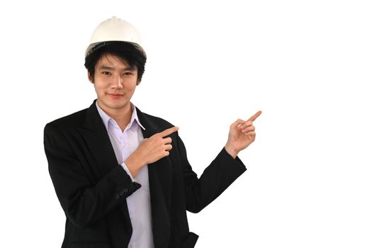 Young architect man wearing helmet and finger to the side isolated on white background.