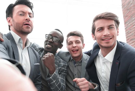 boss and business team takes selfies in the office.photo on memory